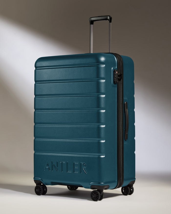a blue suitcase with wheels