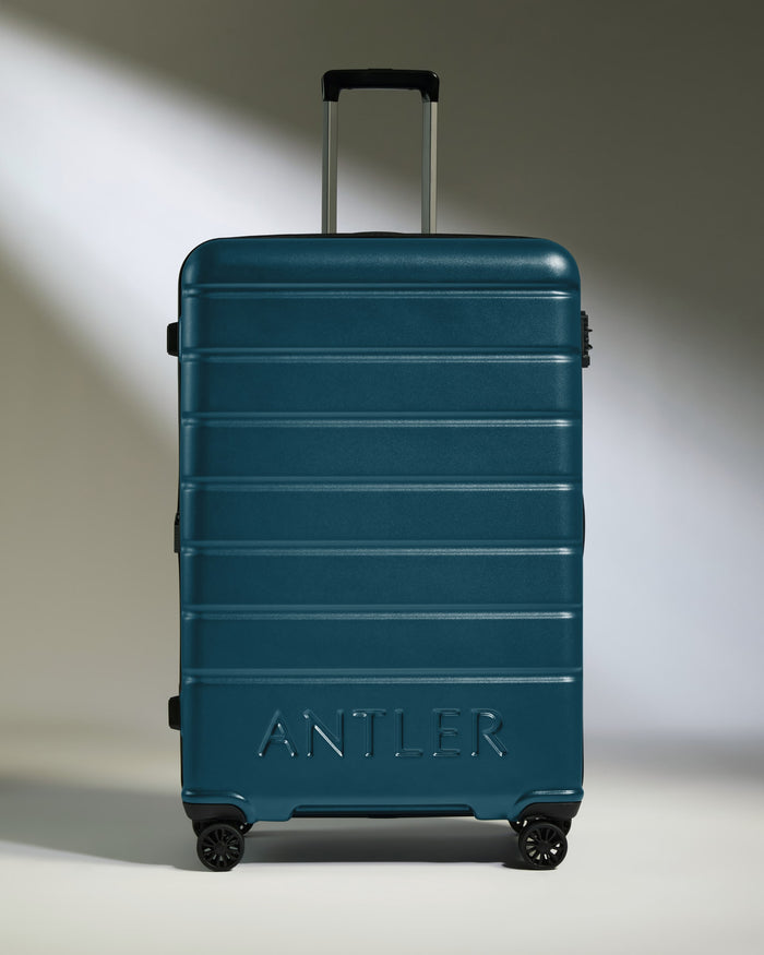 a blue suitcase with handle