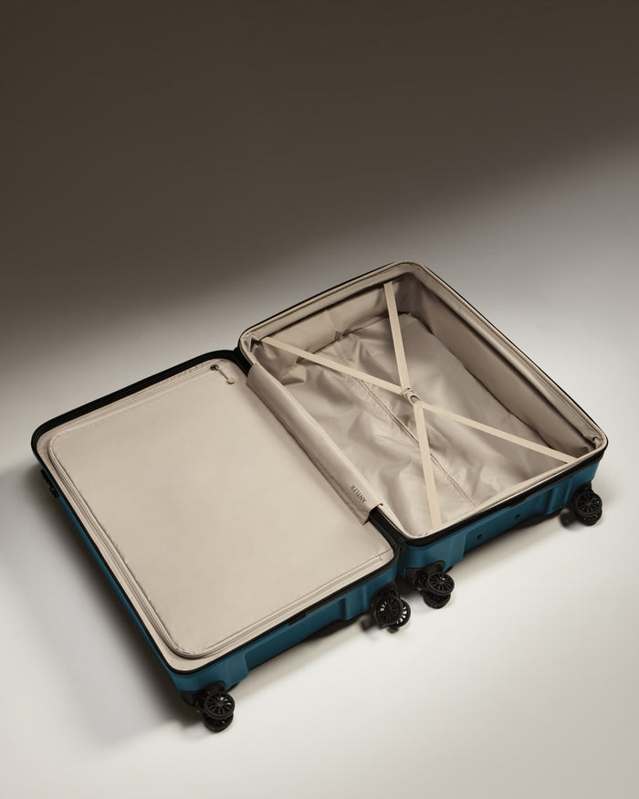 a suitcase with wheels and a lid