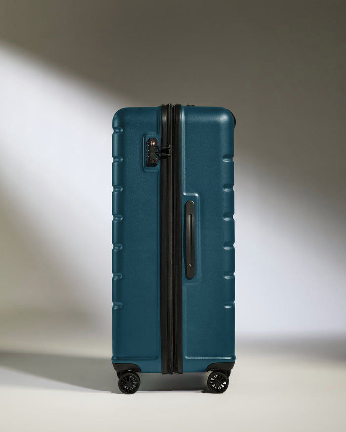 a blue suitcase with wheels