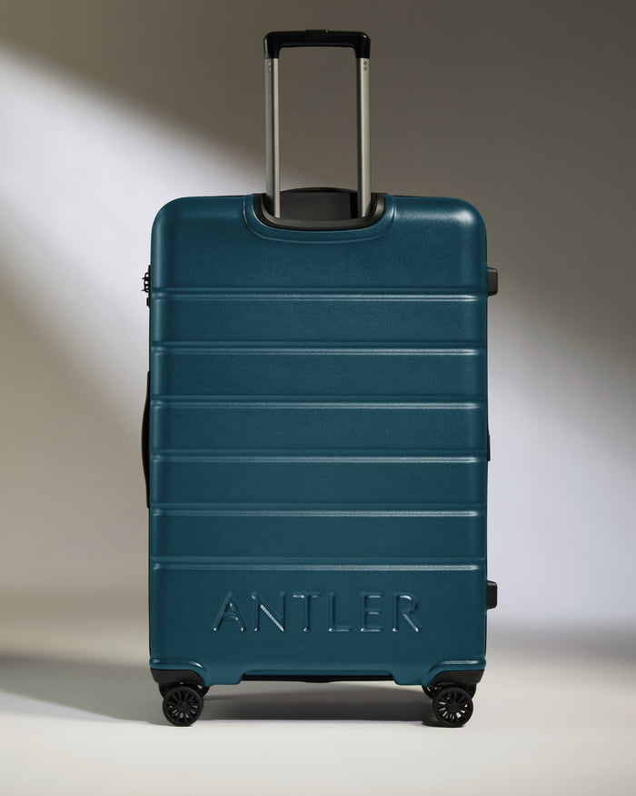 a blue suitcase with handle