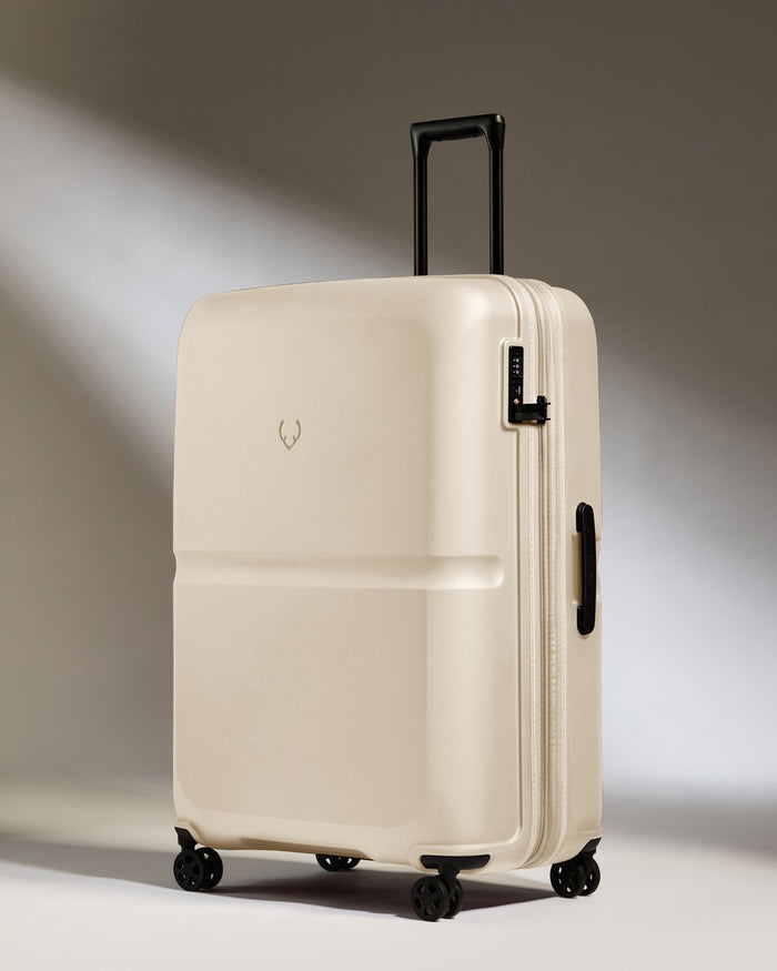 a white suitcase with wheels