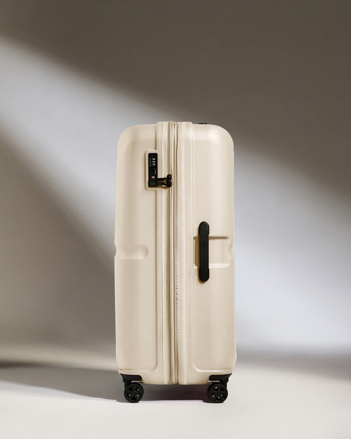 a white suitcase with wheels