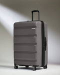 Antler Luggage -  Expandable Large Suitcase in Gloss Gull Grey - Logo Stripe - Expanding Rollercase | Large 4W Expandable Large Suitcase in Gloss Gull Grey - Logo Stripe