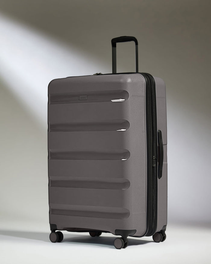 Antler Luggage -  Expandable Large Suitcase in Gloss Gull Grey - Logo Stripe - Expanding Rollercase | Large 4W Expandable Large Suitcase in Gloss Gull Grey - Logo Stripe