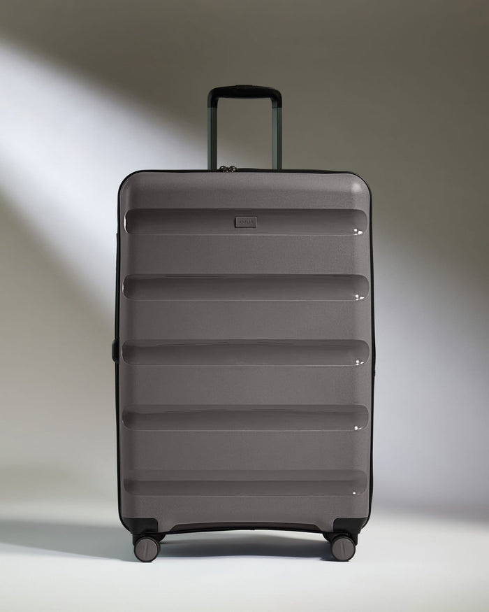 Antler Luggage -  Expandable Large Suitcase in Gloss Gull Grey - Logo Stripe - Expanding Rollercase | Large 4W Expandable Large Suitcase in Gloss Gull Grey - Logo Stripe