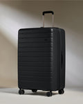 a black suitcase with wheels