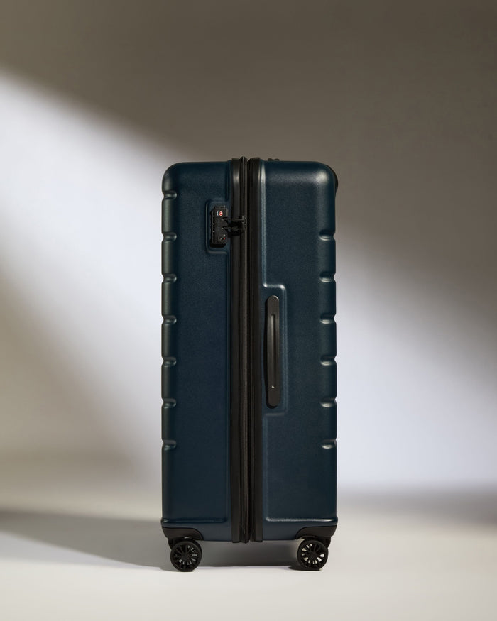 a blue suitcase with wheels