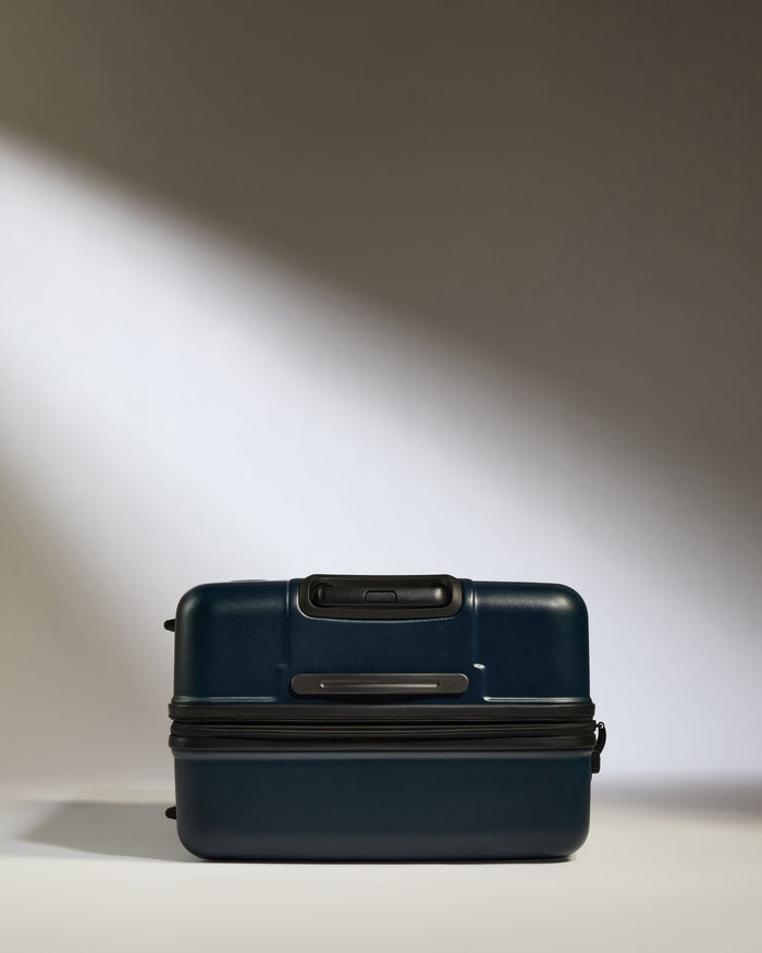 a blue suitcase with a zipper