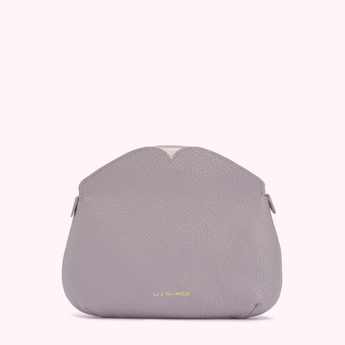 A grey Lulu Guinness purse with a heart-shaped top detail against a white background.