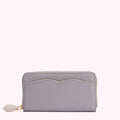 A lavender zip-around wallet on a white background.