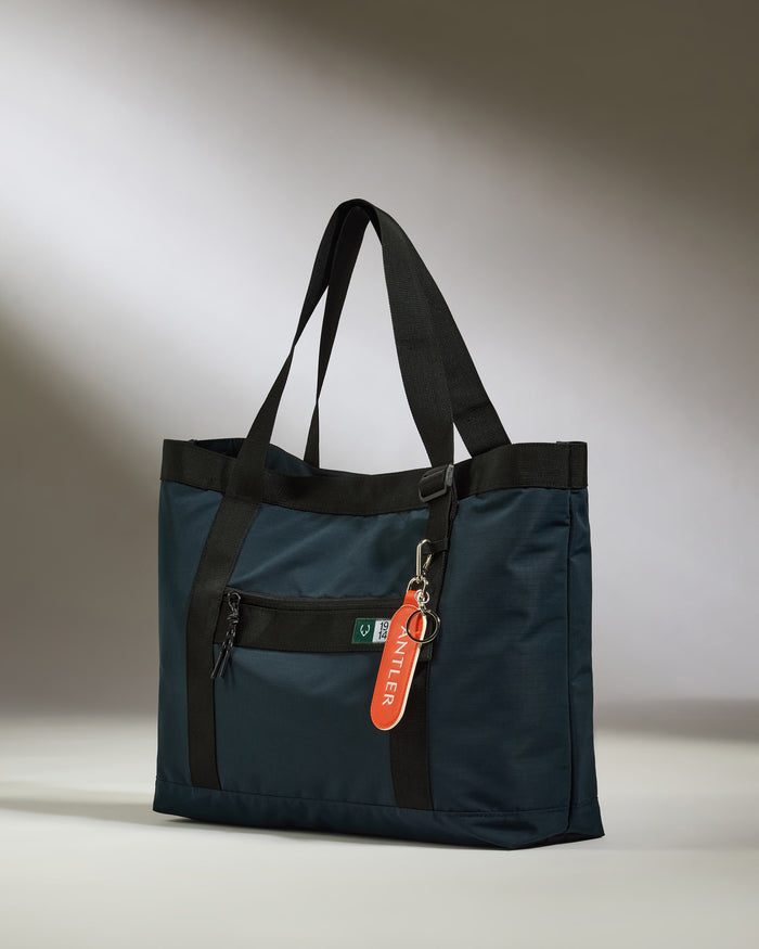 a blue bag with a red tag