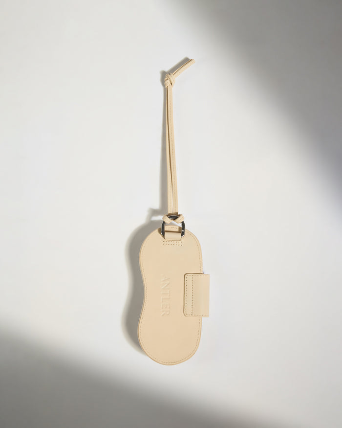 a tan leather luggage tag
