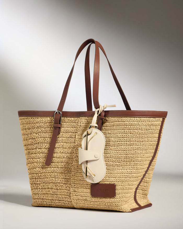 a brown and tan woven bag