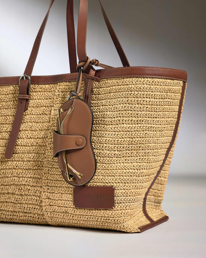 a brown and tan woven bag