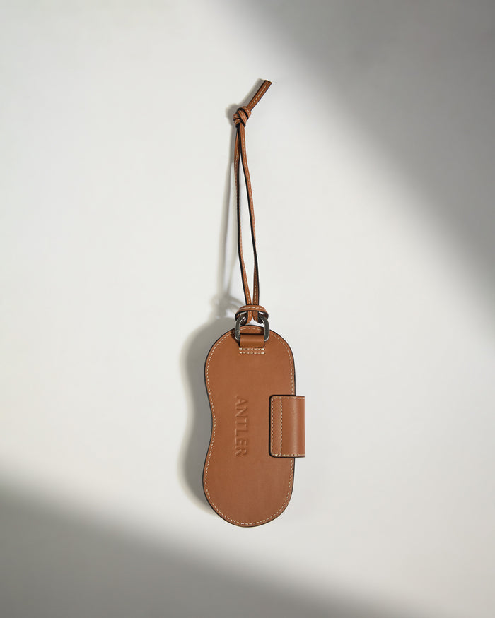 a brown leather luggage tag