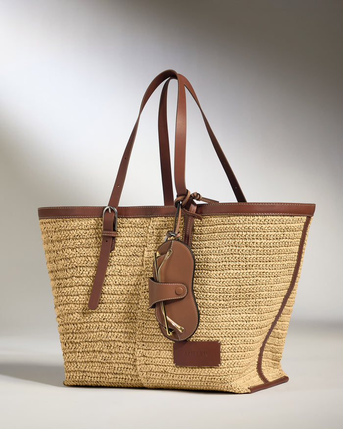 a brown and tan woven bag