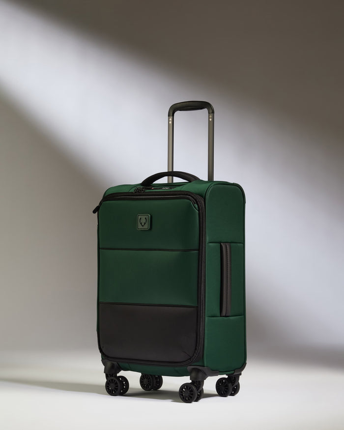 a green and black suitcase