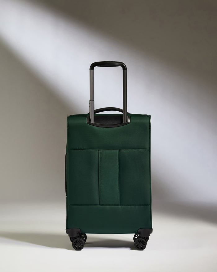 a green suitcase with wheels