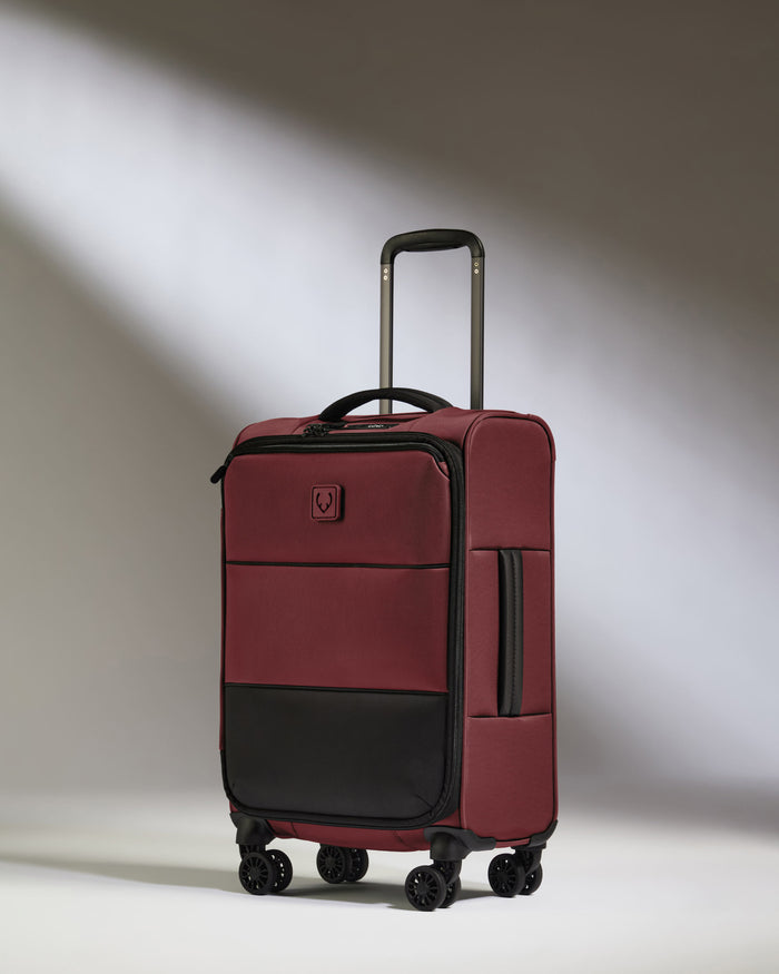 a red suitcase with wheels