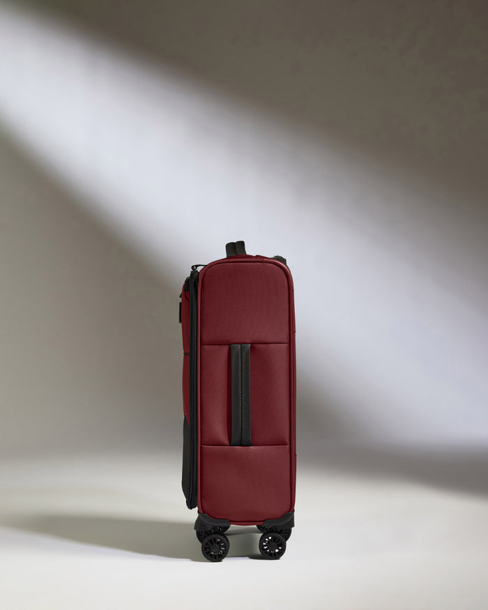 a red suitcase with wheels