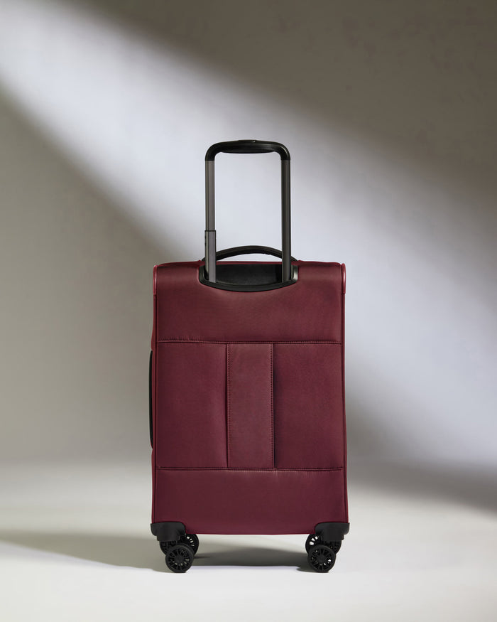 a red suitcase with wheels