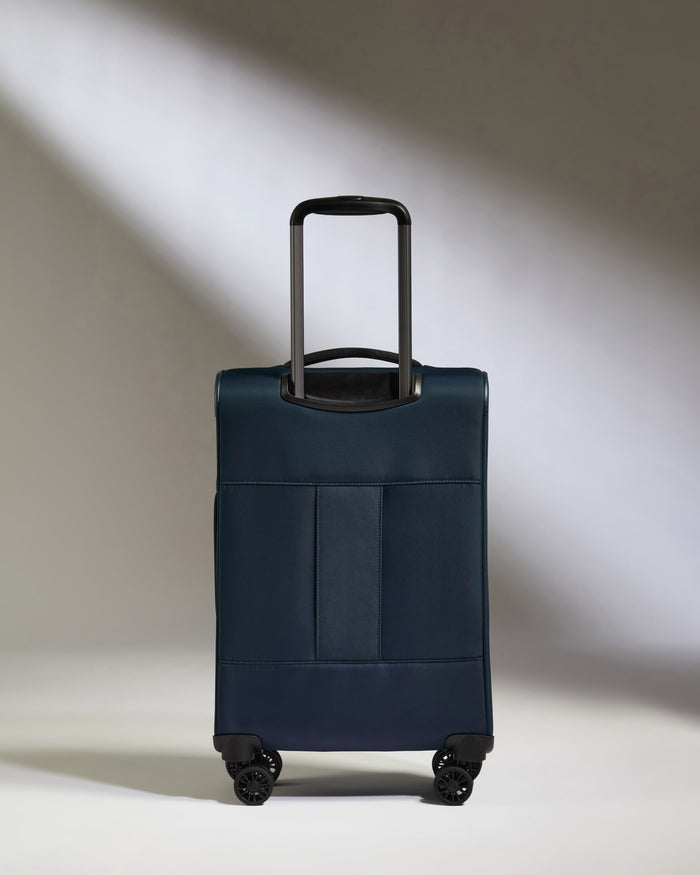 a blue suitcase with black wheels