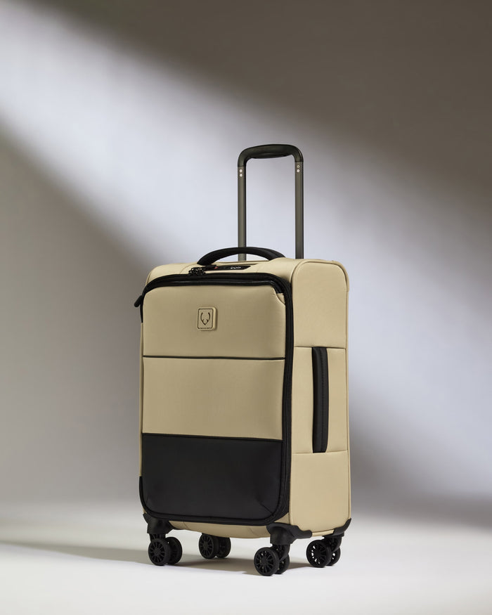 a tan and black suitcase