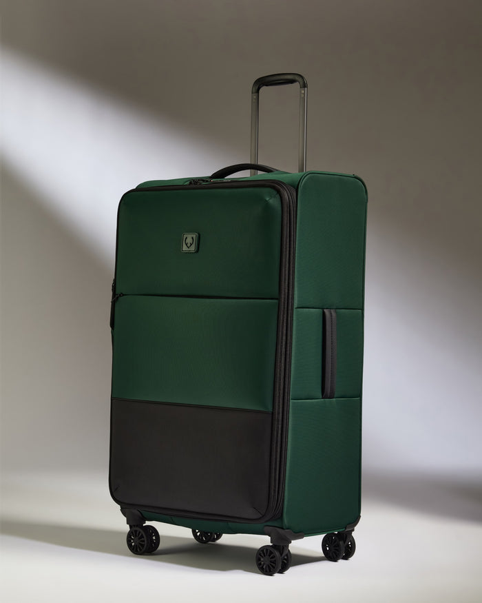 a green and black suitcase
