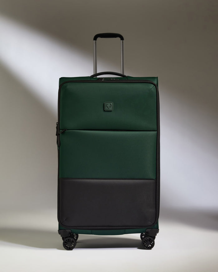 a green and black suitcase