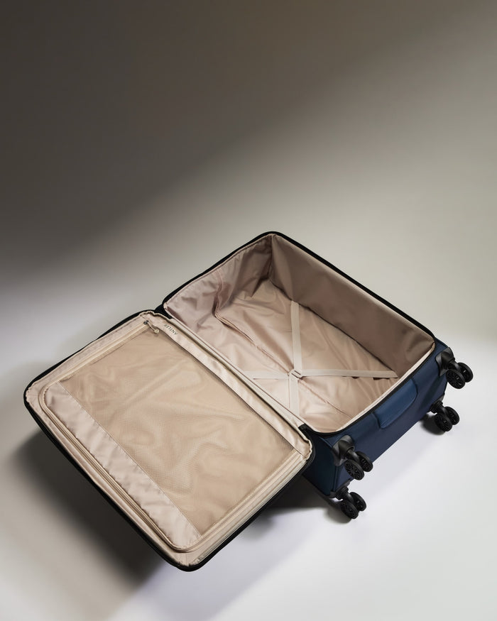 a blue suitcase with wheels