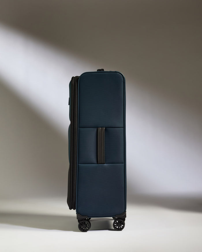 a blue suitcase with wheels