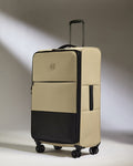 a tan and black suitcase