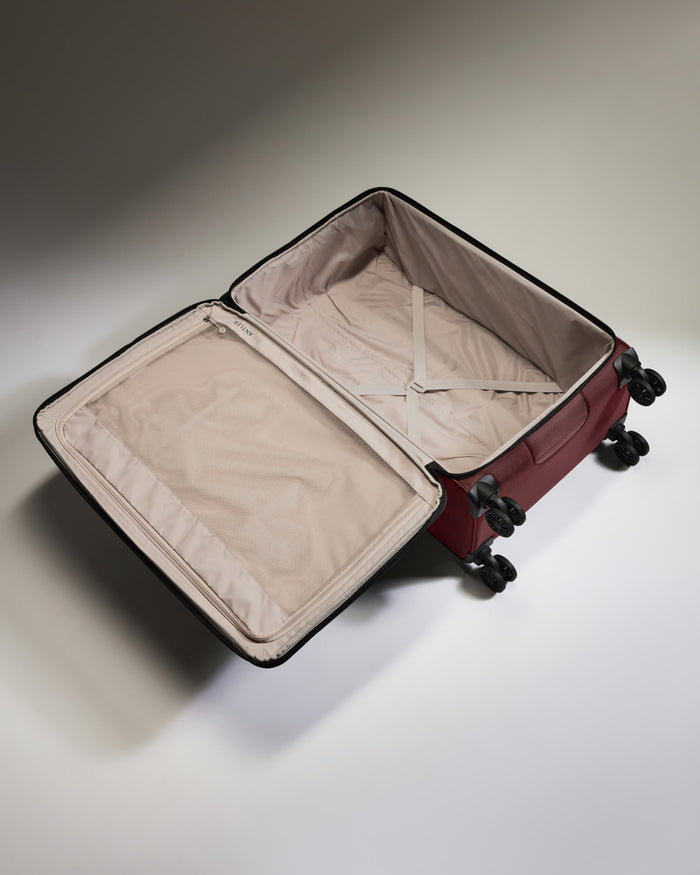 a suitcase with wheels and a lid