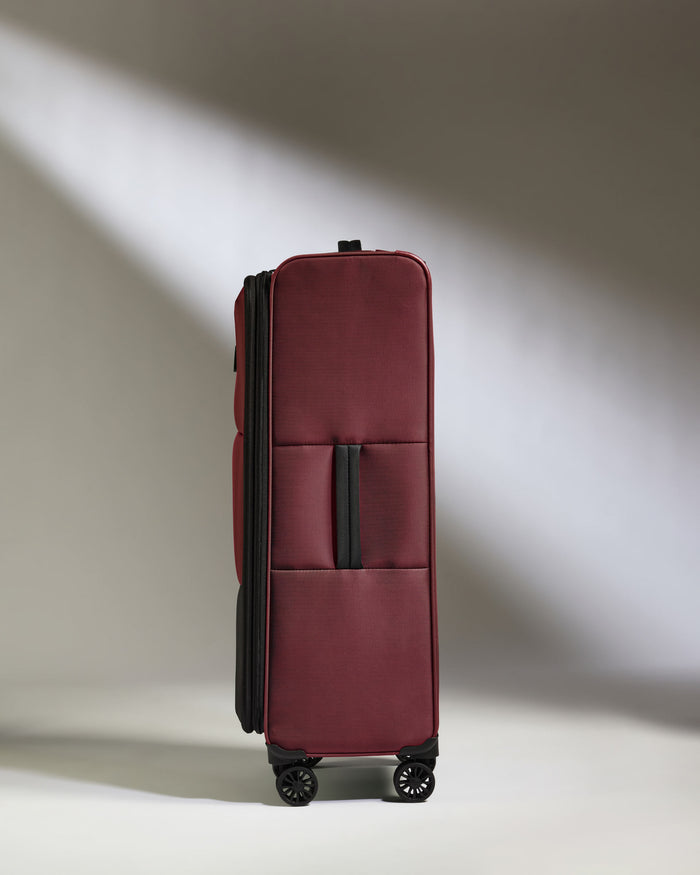 a red suitcase with wheels