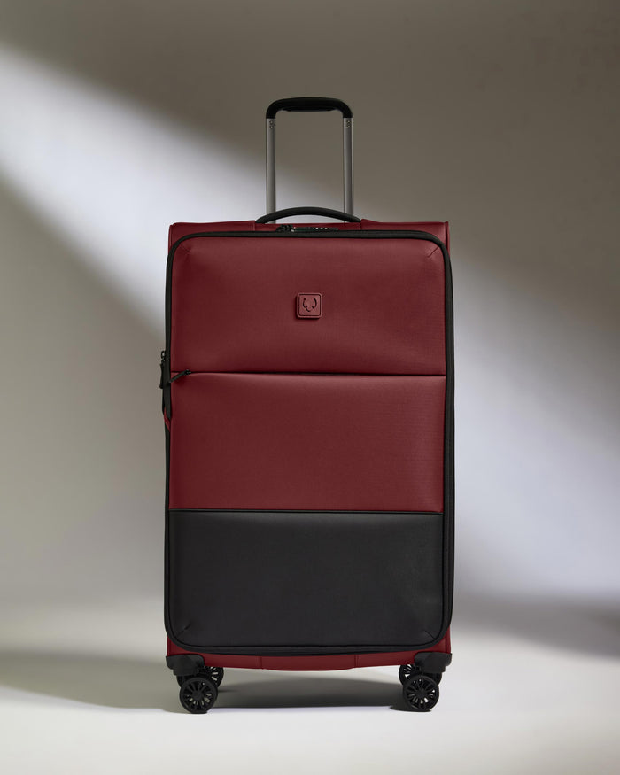 a red and black suitcase