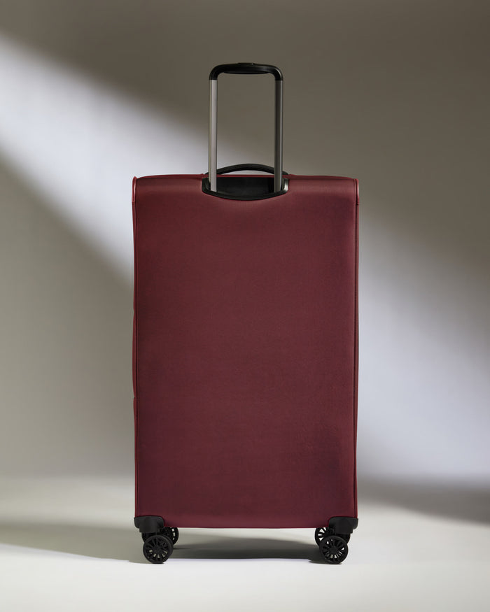 a red suitcase with wheels