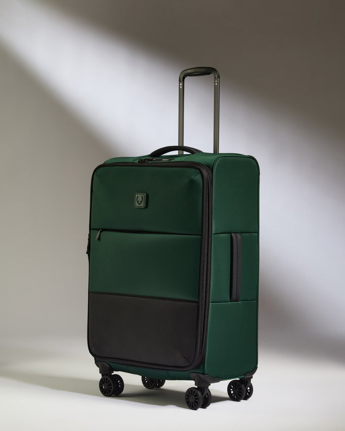 a green and black suitcase