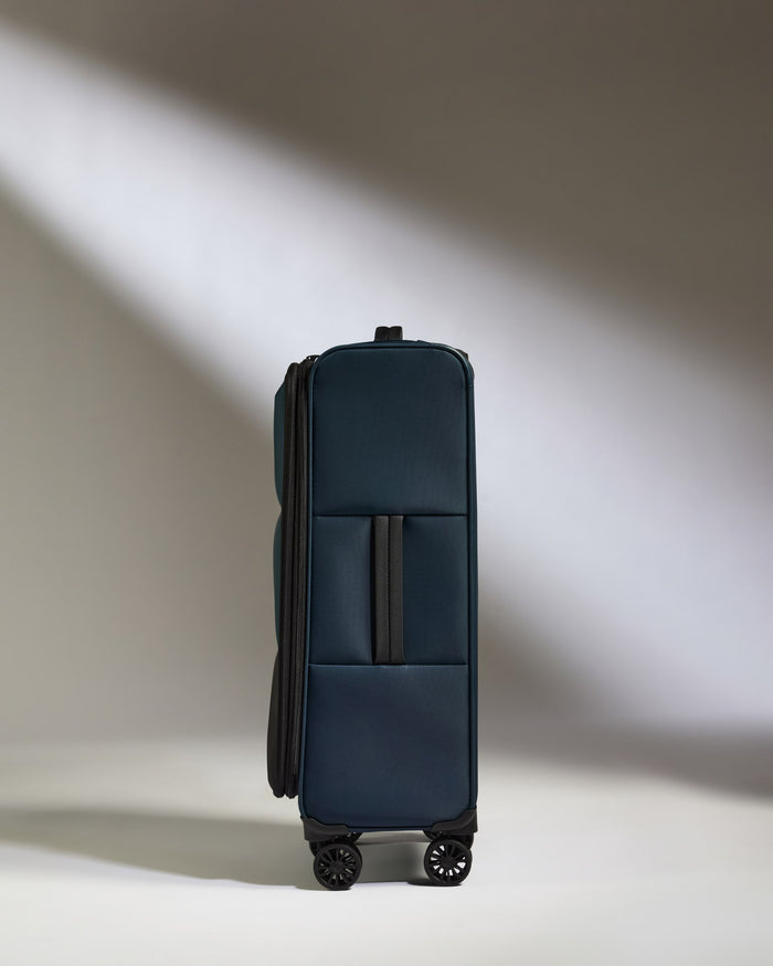 a blue suitcase with wheels