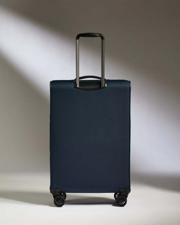 a blue suitcase with wheels