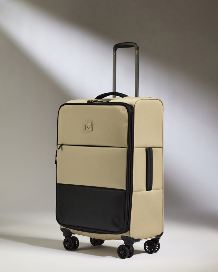 a tan and black suitcase