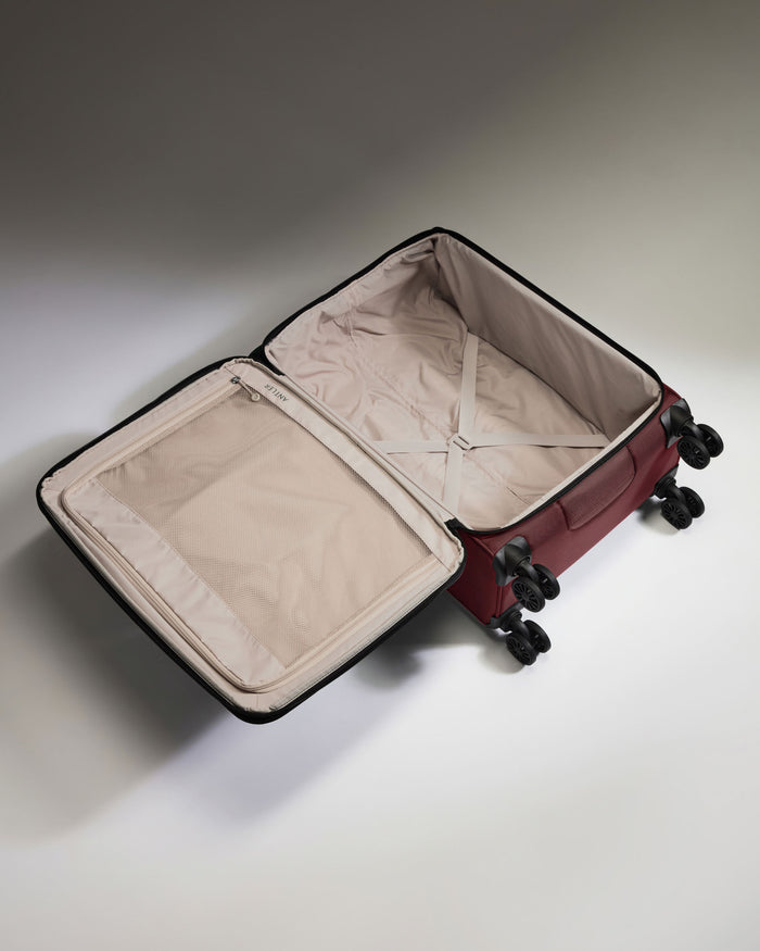a suitcase with wheels and a lid