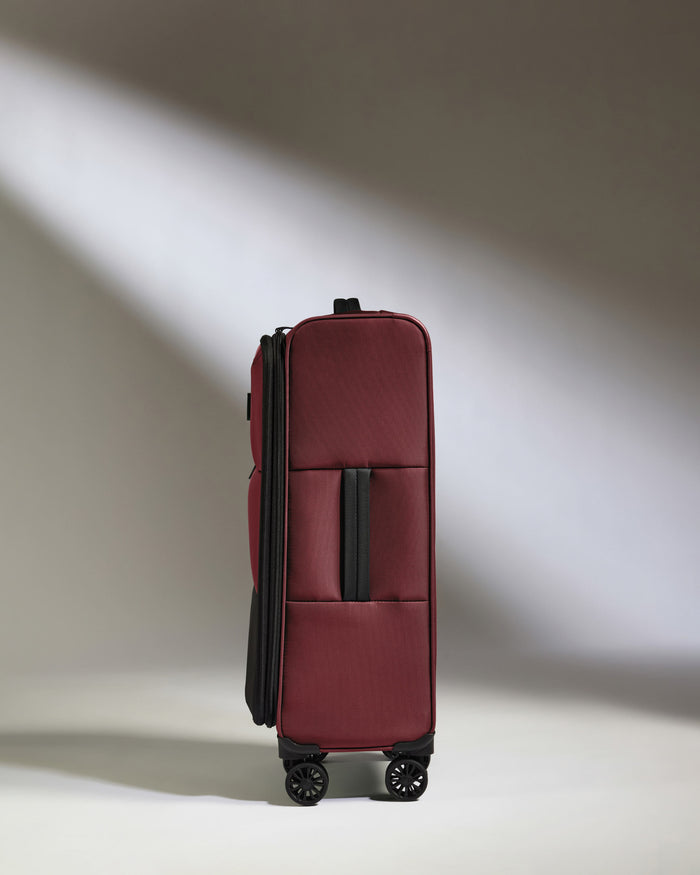 a red suitcase with wheels