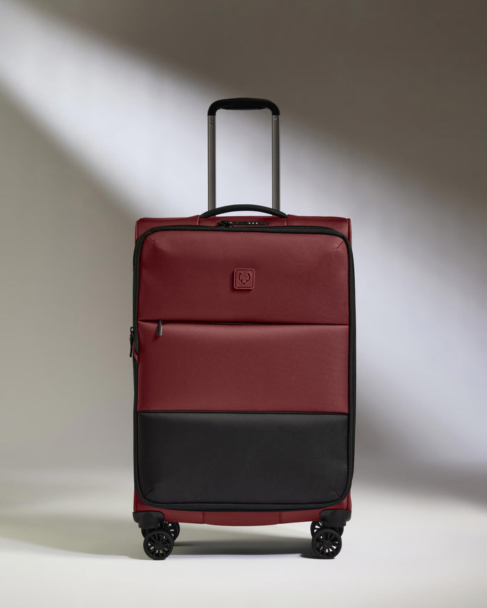 a red and black suitcase
