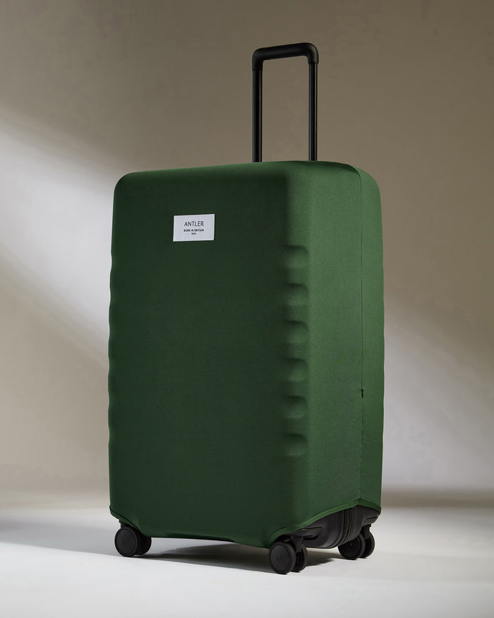 a green suitcase with wheels