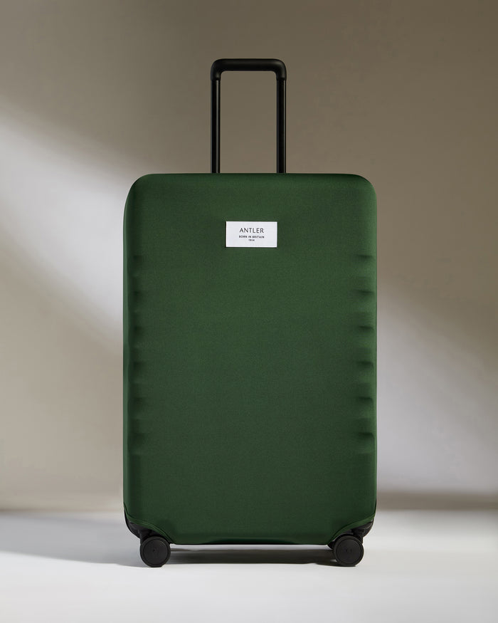 a green suitcase with a white label