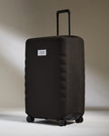 a black suitcase with two handles