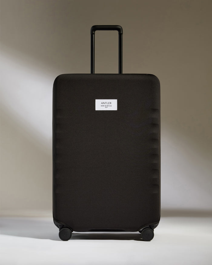 a black suitcase with a handle