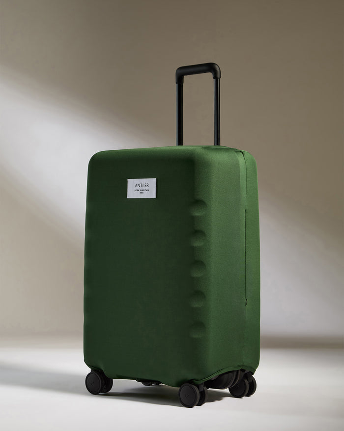 a green suitcase with wheels