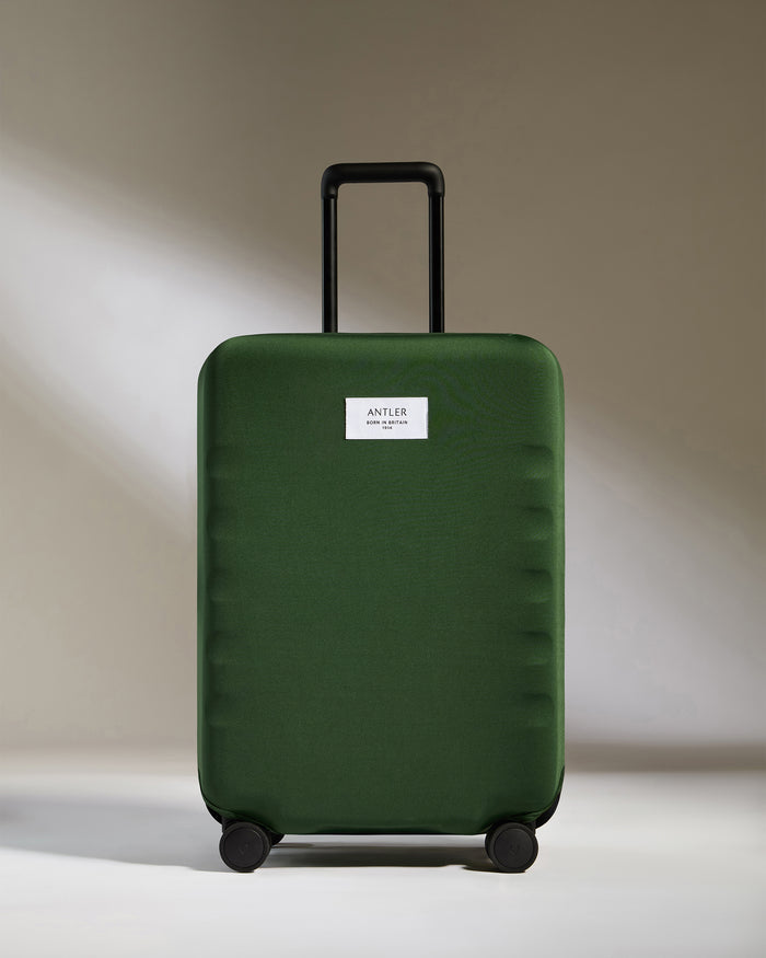 a green suitcase with a white label